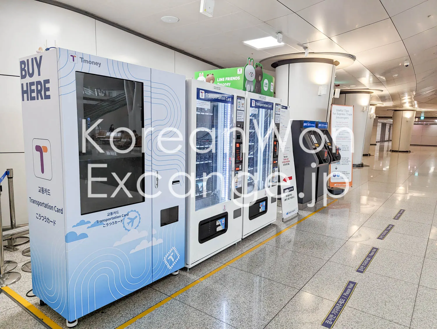 Rows of T-money transit-card top-up machines inside a station, including a LINE FRIENDS-branded ticket machine.