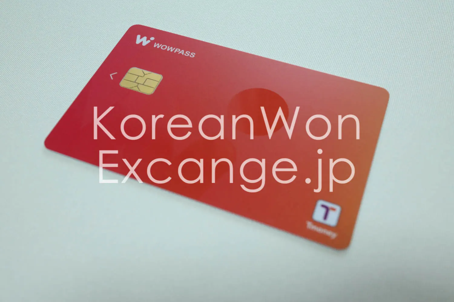 A close-up of the red face of WOWPASS, a prepaid travel card for Korea.